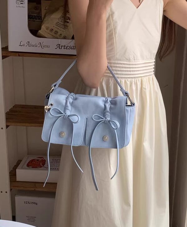 Sky Blue Mini Drawstring Bow Sling Bag | Wonhee - ILLIT